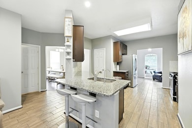 Kitchen view showcasing granite countertops, penin