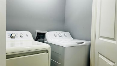 Laundry area featuring laundry area and washer and dryer