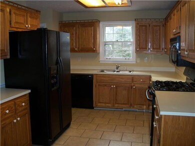 Super nice kitchen and all appliances stay. Tile flooring and Oak cabinets.