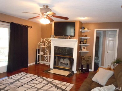 Wood burning fireplace and door leading to the scr