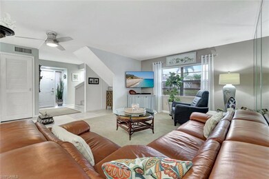 Living room featuring light tile patterned floors,
