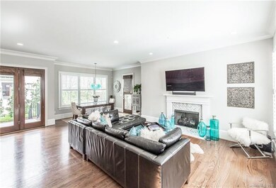 Great room with hardwood floors, tile fireplace, 1