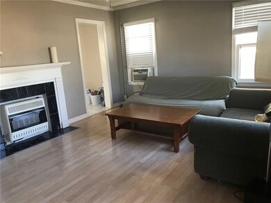 Living room with doorway to eat-in kitchen.