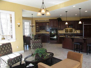 Kitchen. Wet bar in Kitchen with cherry cabinets a