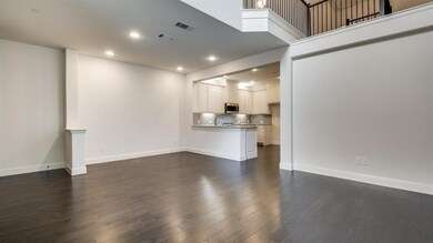 With open railing upstairs and elegant spaces down