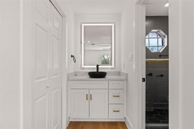 Full bath with vanity, healthy amount of natural 