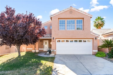 View of front of house featuring a tile roof, stucco siding, covered porch, and concrete driveway