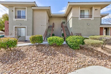 View of front of home with stairs and stucco sidin