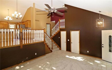 Another view of the great room space shows stairs 