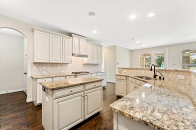 Stunning island kitchen with high/low cabinetry