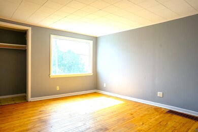 Unfurnished bedroom with a closet and light hardwo