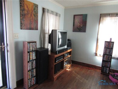 living room by entrance door off front porch