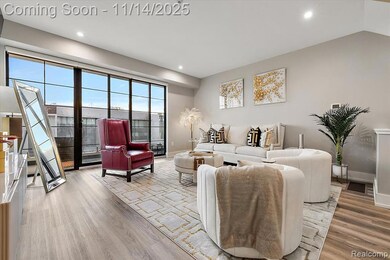 Living room featuring light wood-style flooring and recessed lighting