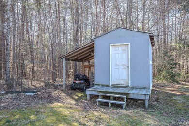 View of outdoor structure featuring a carport