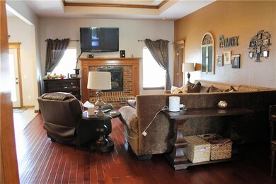 Living Room has a Trey Ceiling with Crown molding 