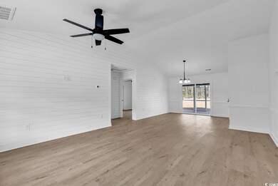 Unfurnished living room with light hardwood / wood