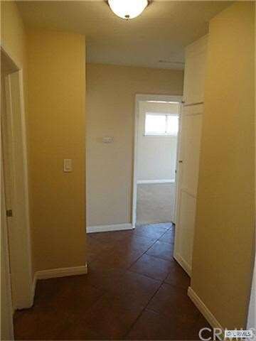 clean hall way to full bath and three bedrooms
