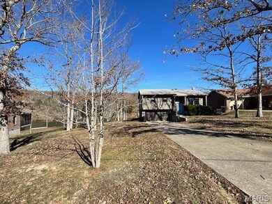 View of front facade with driveway and a garage