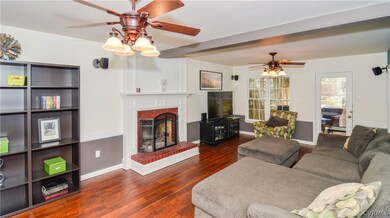 Family Room - Hand scraped teak hardwood floors, r