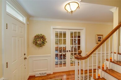 Spacious entrance.  This view you can see french doors leading into the Dining room