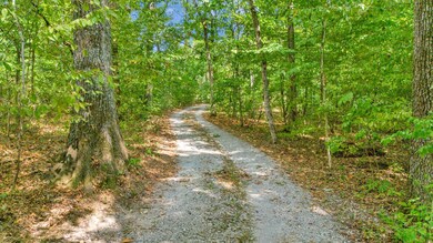 As you drive down the driveway, you will feel like you're passing through a serene park.