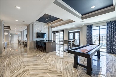 Game room with french doors, ornamental molding, a