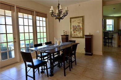 Dining area with light tile patterned flooring and