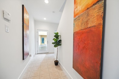 There is a bright and  welcoming entry with tile f