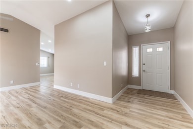 Foyer entrance with LVP flooring throughout the ho