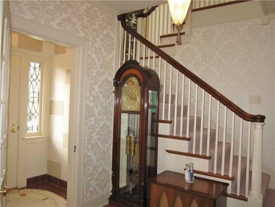 Entry/Foyer. tiled breezeway between doors opens i