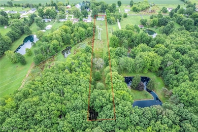 View of property location featuring a nearby body of water and property boundaries highlighted