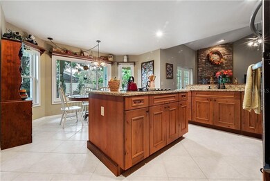 Kitchen overlooks breakfast nook and family room.