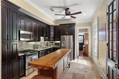 Kitchen features plenty of storage, granite and st