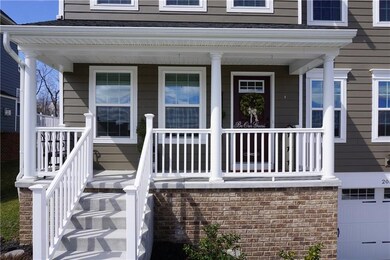 Greet guests on the spacious and inviting front po