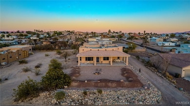 Aerial view at dusk featuring a residential view