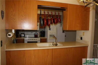 Kitchen with open view of breakfast room