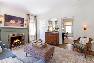Living room featuring wood finished floors, arche