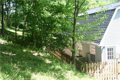 View of the back of the house.... there is a hill behind the house with plenty of trees.  Just over the hill is Moonshine Hill Bed and Breakfast retreat.