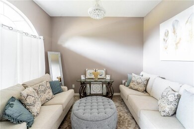 Living room with baseboards and carpet flooring