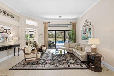 Tiled living area with crown molding and baseboards