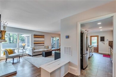 Spacious double door entry with tile leading into 