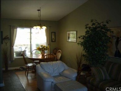 Vaulted ceilings in living room and dining room.