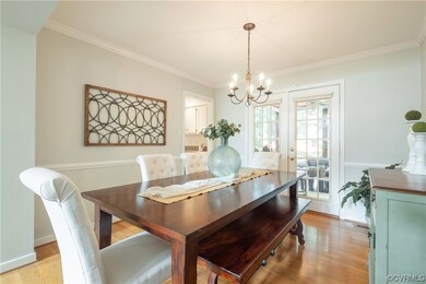 Dining Rm w/french doors leading to screened porch. Hdwd floors.