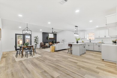 Kitchen featuring ceiling fan, light hardwood / wo