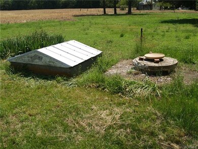 Well to Side of Dwelling