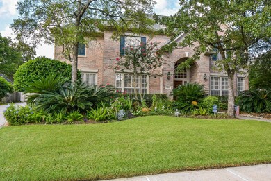 Beautiful brick elevation, mature landscaping, and a generous lot size.