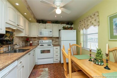 Fully updated kitchen. Impact window, stone backsp
