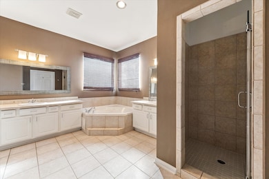 Glass enclosed separate shower.