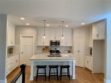 Kitchen features soft close drawers, walk-in pantr