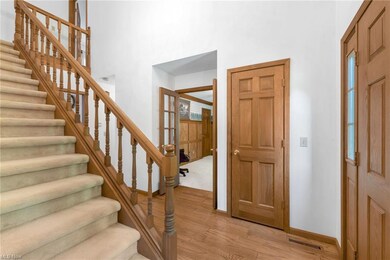 View of hardwood floored foyer entrance